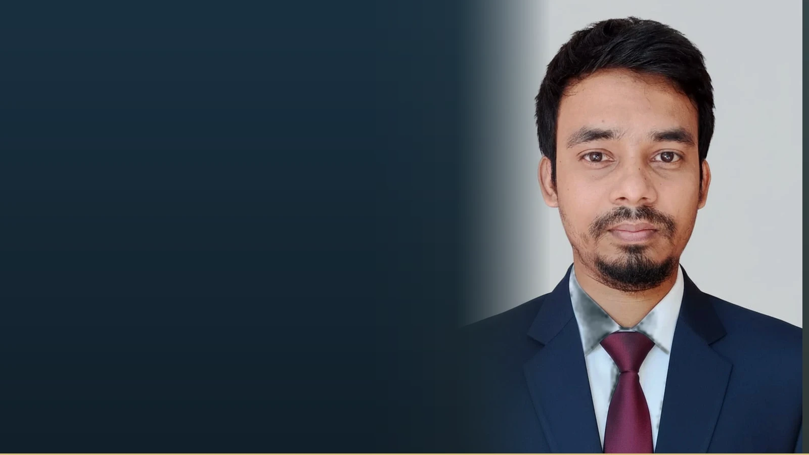 Iqbal Hossain, an administrative officer, poses for a professional headshot.